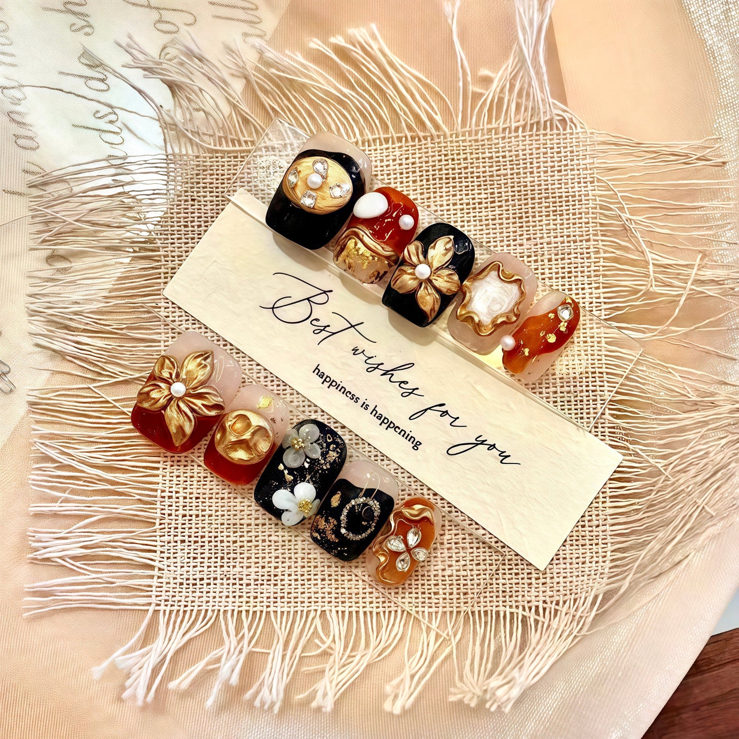 Decorative hair clips with pearls and flowers on a textured fabric background