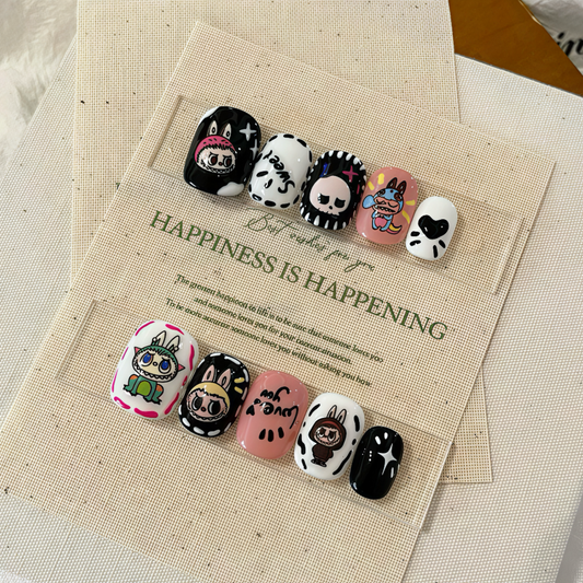 Set of cartoon-themed buttons on a card with text 'Happiness is happening' on a textured surface.
