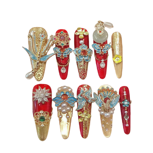 Decorative nail art designs with red, gold, and blue colors on a white background