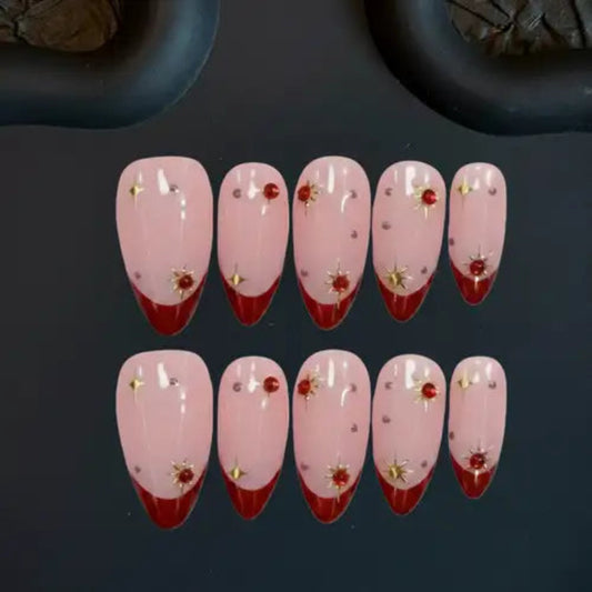 Set of pink and red nail designs with floral decorations on a dark background