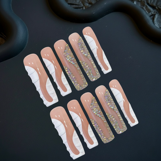 Set of decorative false nails with glittery tips on a black background