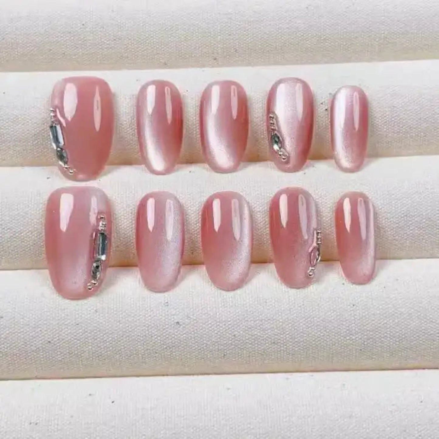 Set of pink nail samples on a white background