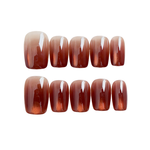 Set of brown gradient nail polish strips on a white background