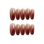 Set of brown gradient nail extensions on a white background