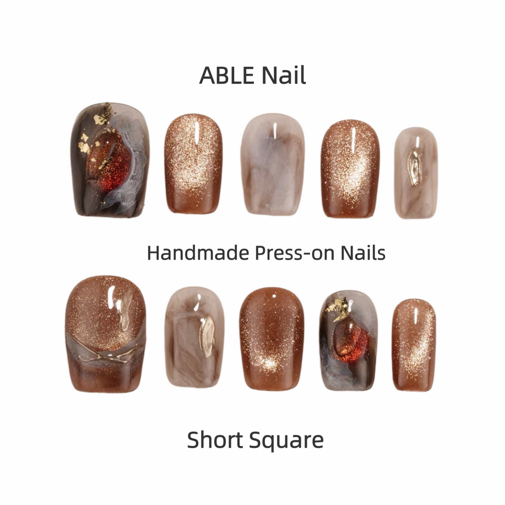 Collection of handmade press-on nails with various designs and colors on a white background, labeled 'ABLE Nail'.