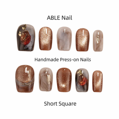 Collection of handmade press-on nails with various designs and colors on a white background, labeled 'ABLE Nail'.
