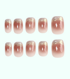 Set of pink and gold gradient nail designs on a white background