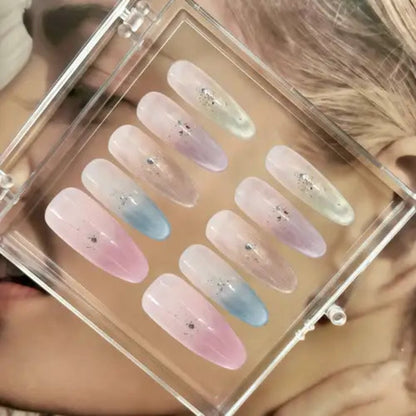 Set of pastel-colored nail samples in a clear display case.