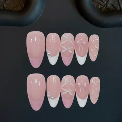 Set of pink and white gradient nail designs on a dark background