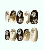 Nail art with floral designs on a white background