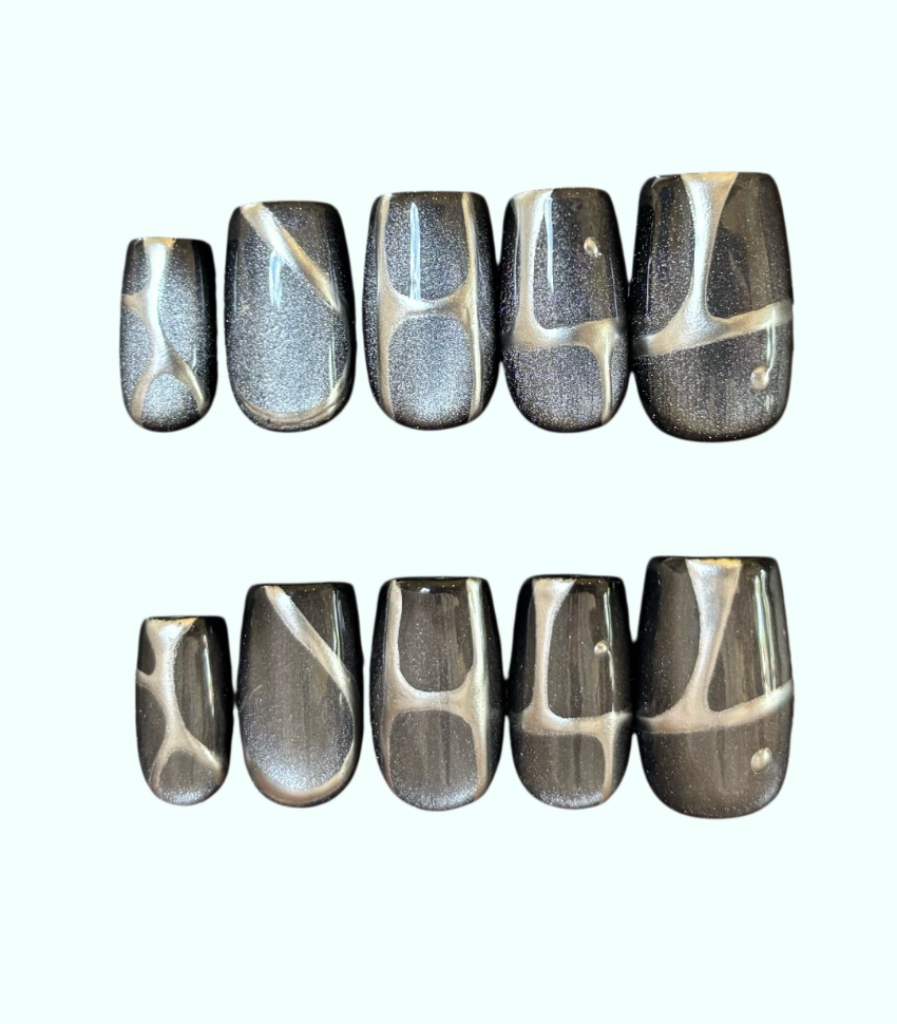 Set of silver and black marbled nail art designs on a white background