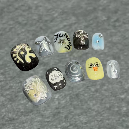 Collection of variously designed nail art samples on a gray background