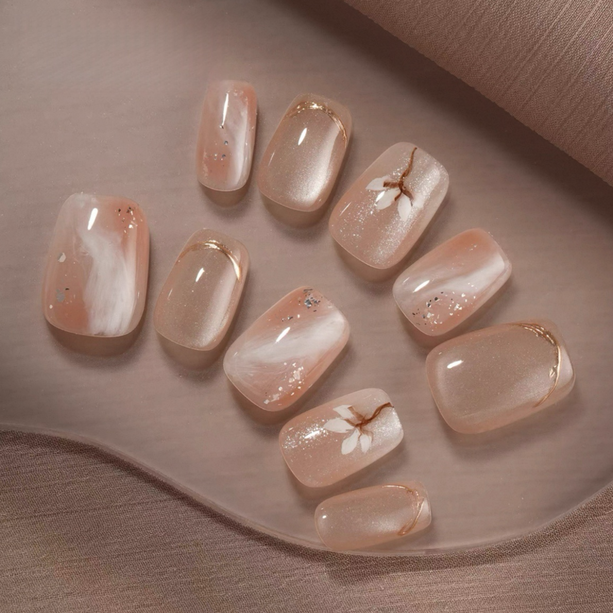 Set of decorative nail art on a neutral background