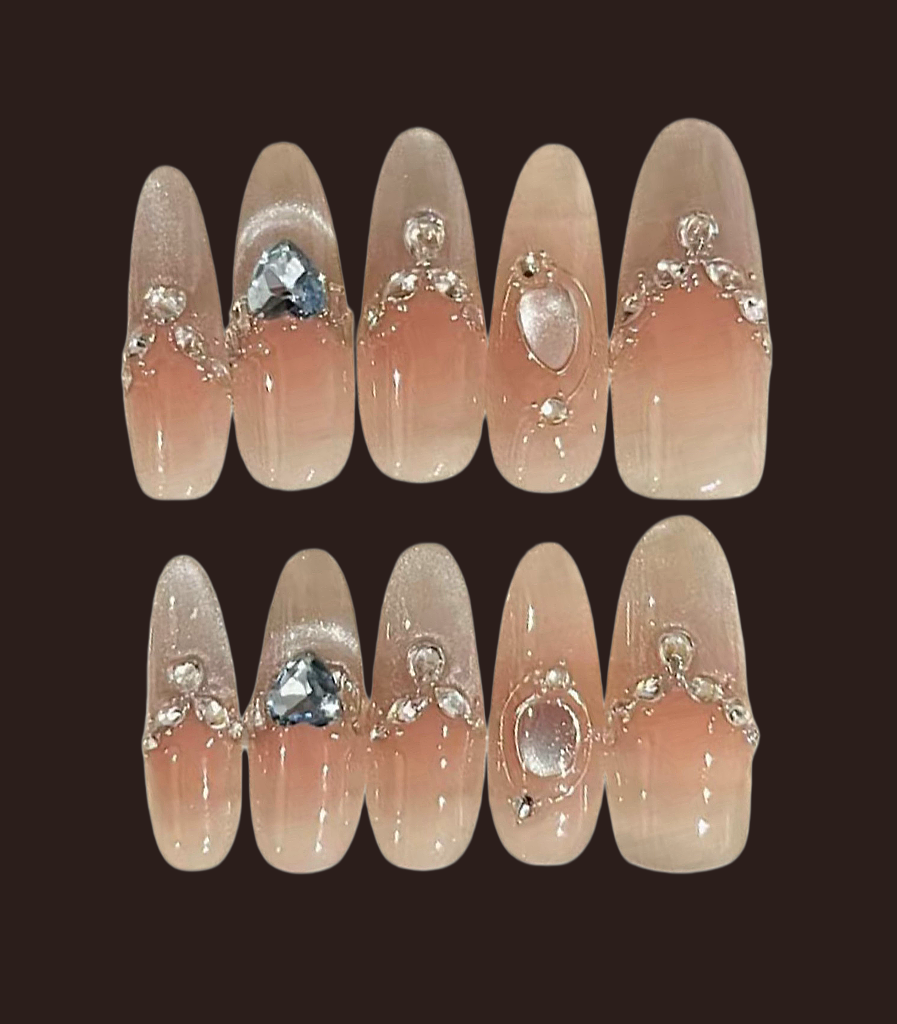 Set of decorative nails with gemstones on a dark background