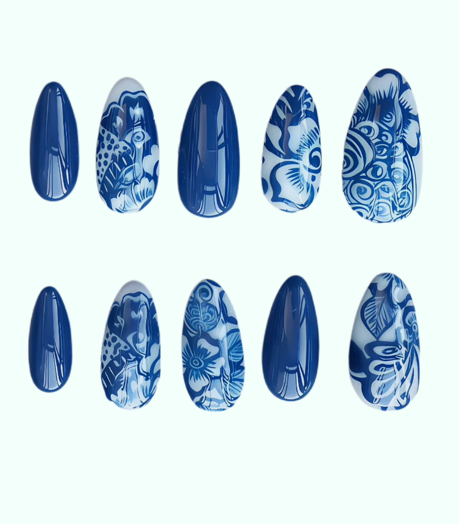 Set of blue and white patterned nail art designs on a white background