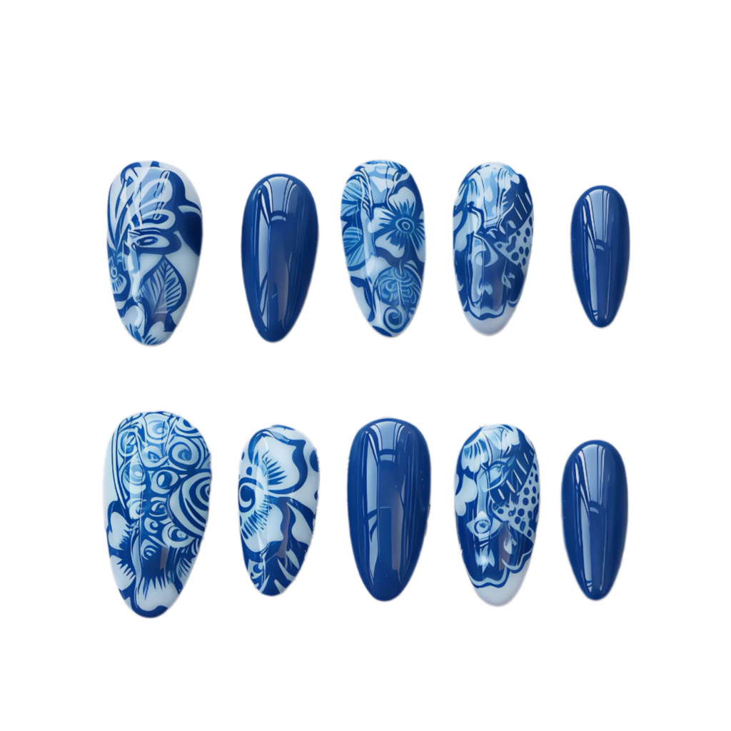 Set of blue and white patterned nail designs on a white background