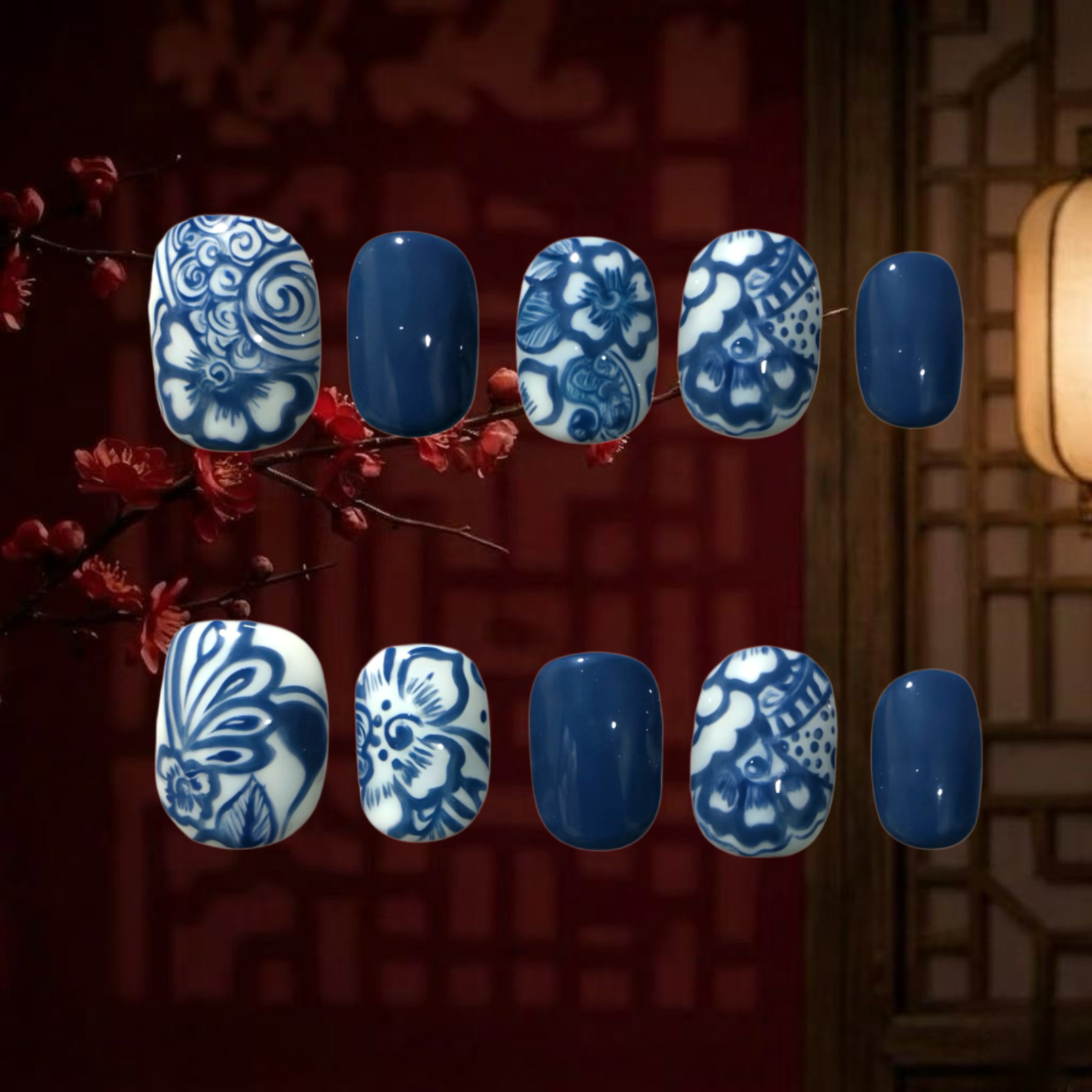 Nail art designs with blue and white patterns on a dark background