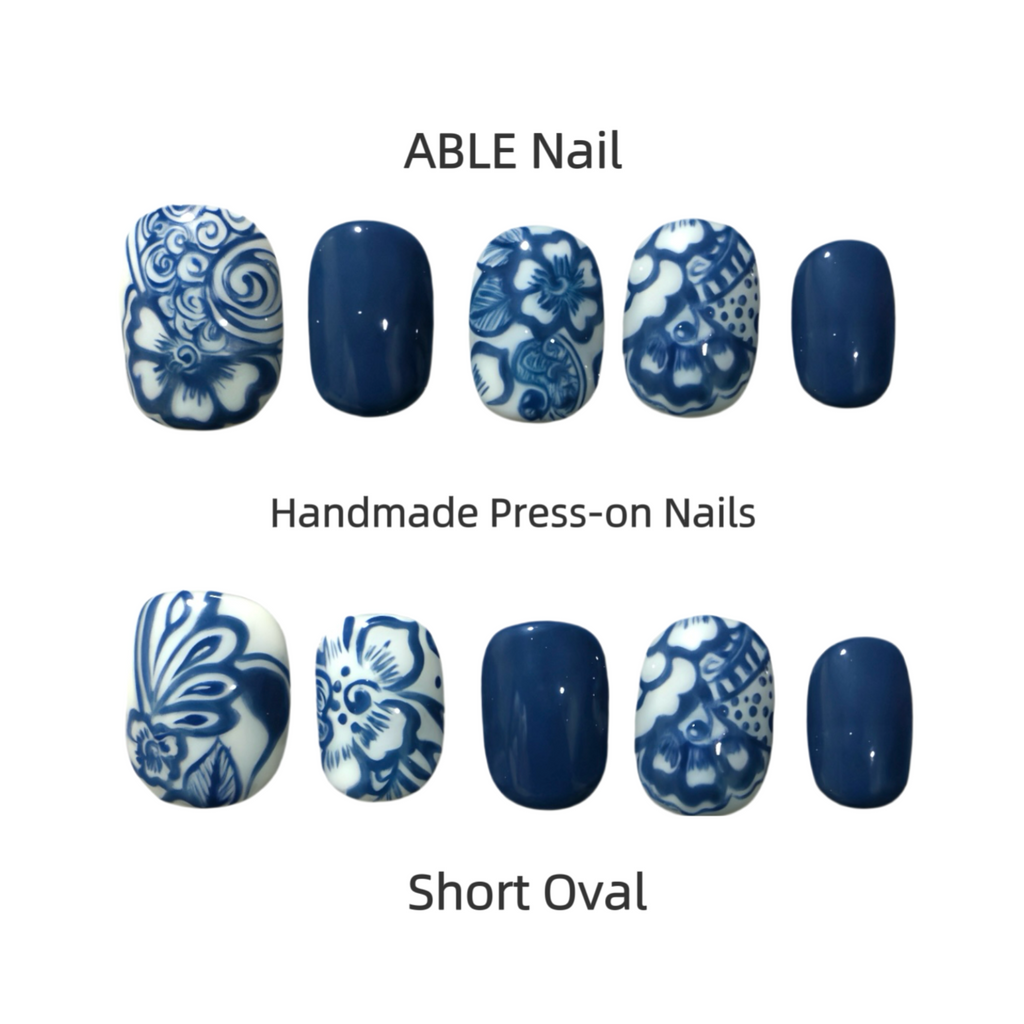 Handmade press-on nails with blue and white designs on a white background, labeled 'ABLE Nail'.