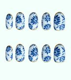 Set of blue floral nail designs on white background