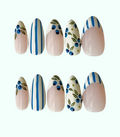 Set of decorative nail art with blue and green patterns on a white background