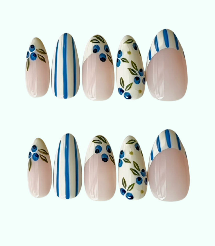 Set of decorative nail art with blue and green patterns on a white background
