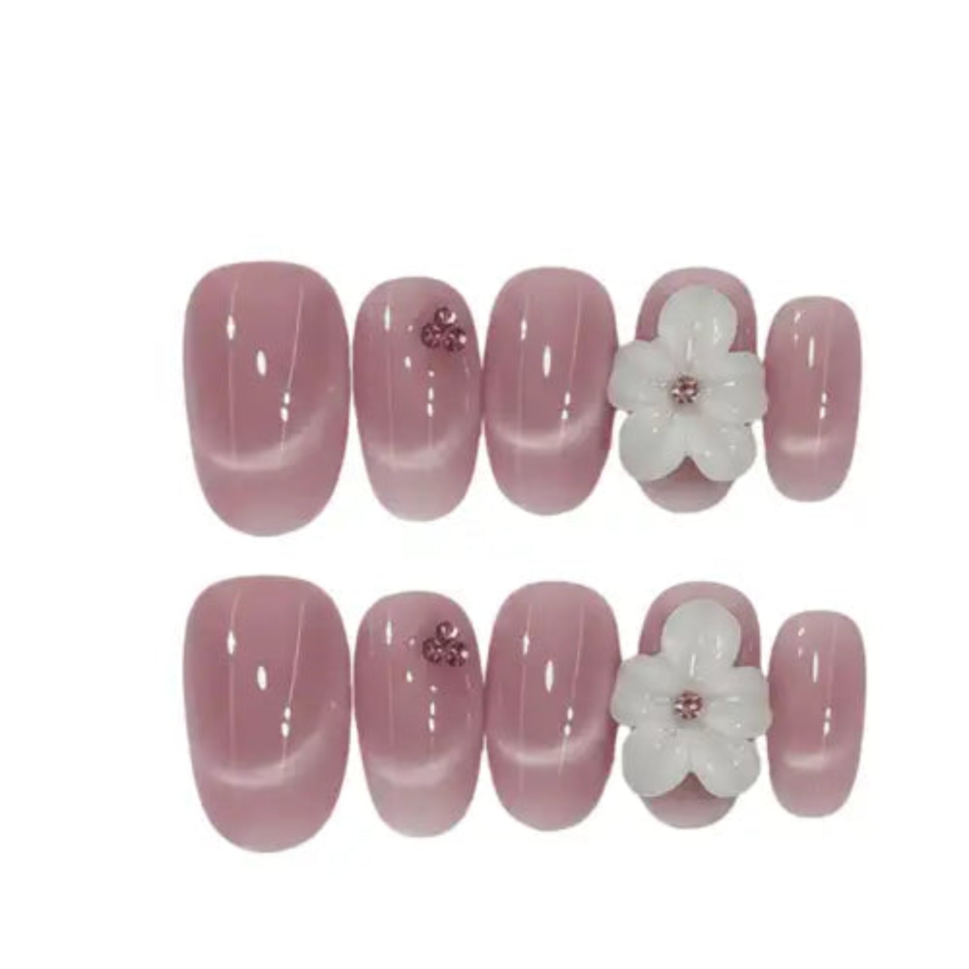 Set of pink nail extensions with white flower decorations on a white background