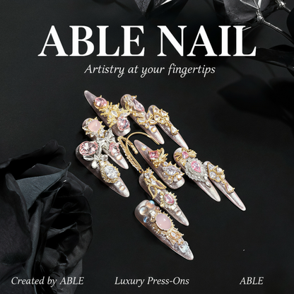 Decorative nail art press-ons with 'ABLE NAIL' branding on a black background