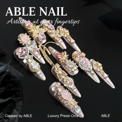 Decorative press-on nails with gemstones on a black background, featuring the brand 'ABLE'.