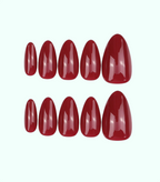 Set of red nail polish on a white background