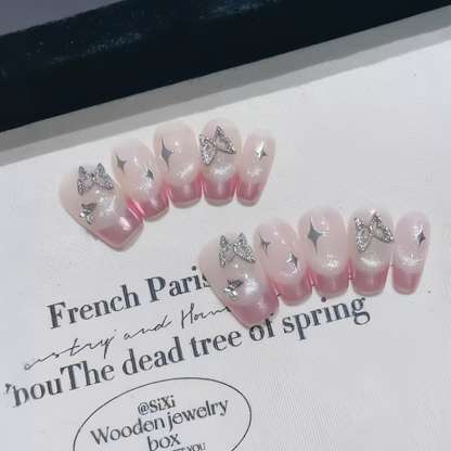 Decorative false teeth with pink and white gradient and star-shaped embellishments on a white background with text.