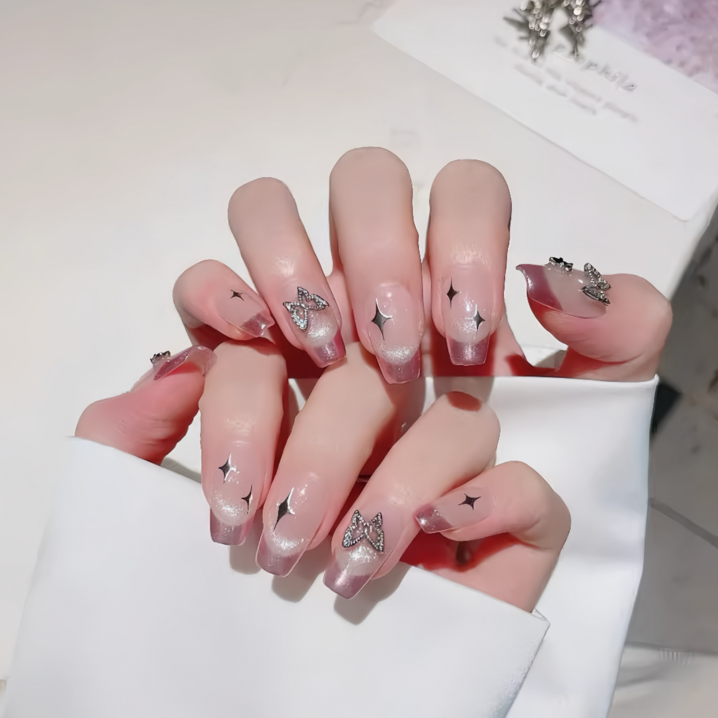 Nails with decorative designs on a white background