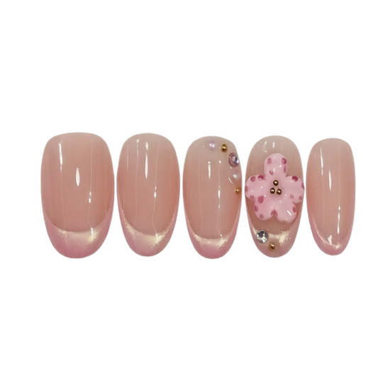 Set of false nails with a decorative design on a white background