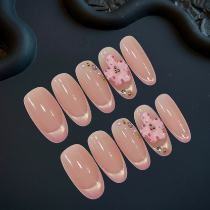 Set of pink nail art designs on a dark surface