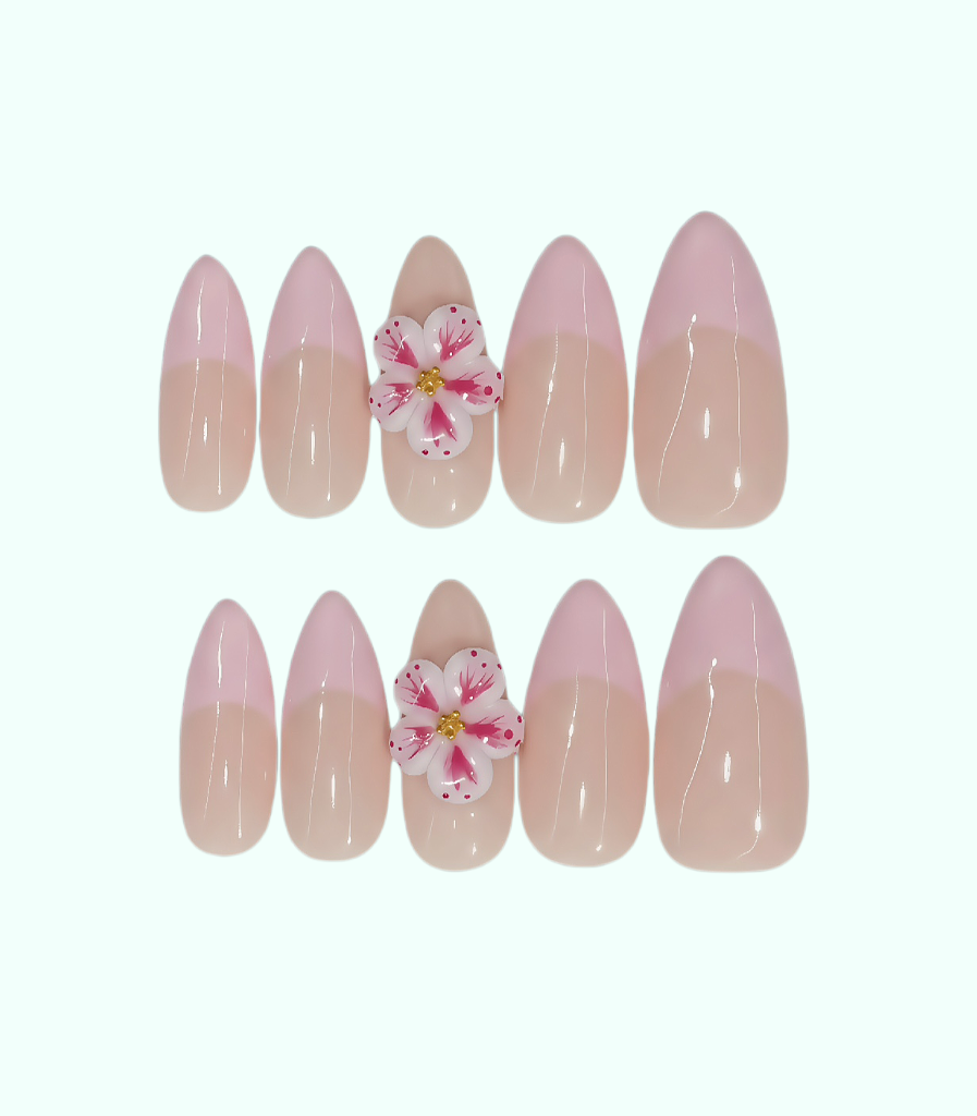 Set of pink and beige nail art with floral decorations on a white background