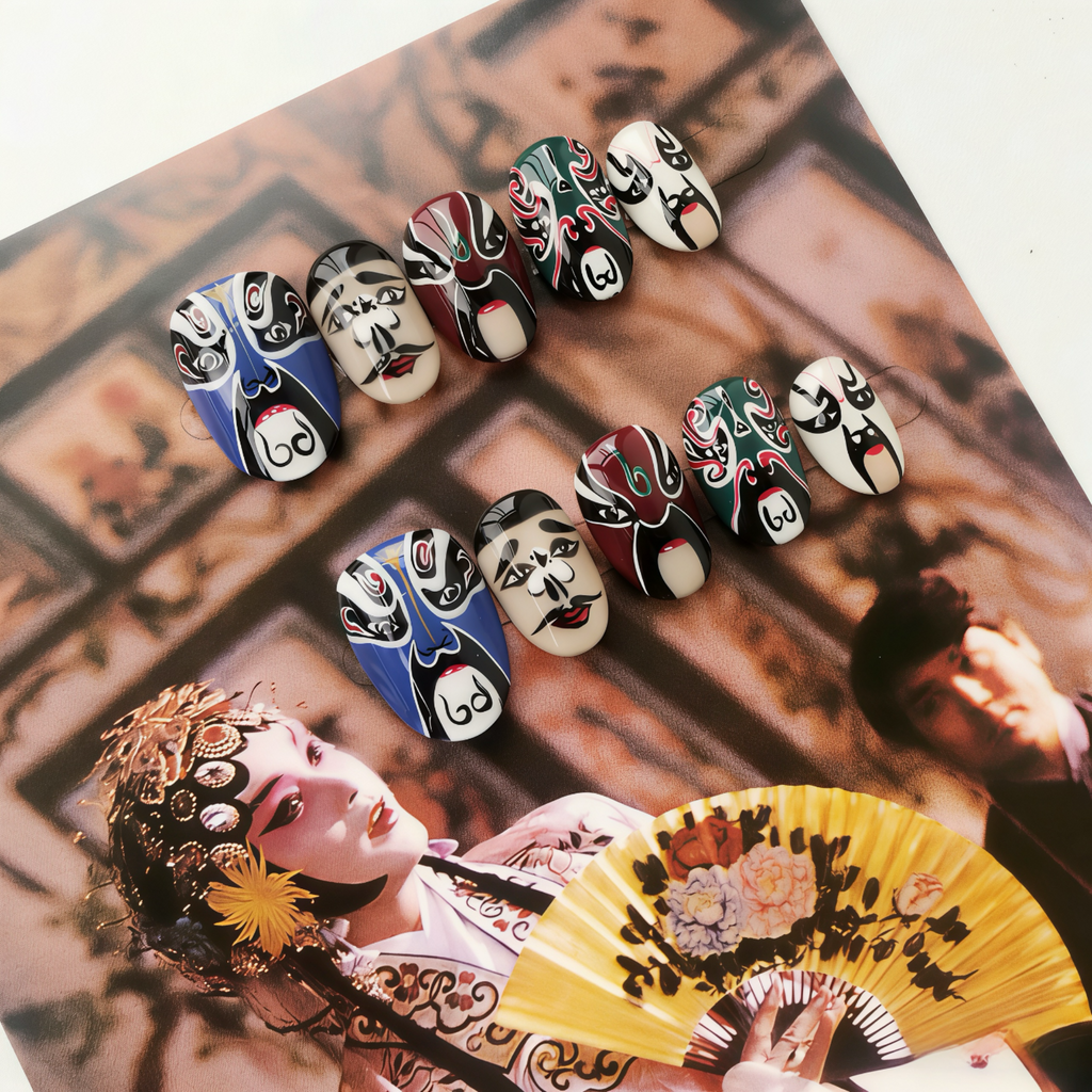 Colorful nail art designs inspired by traditional masks on a blurred background of a person with makeup and a fan.