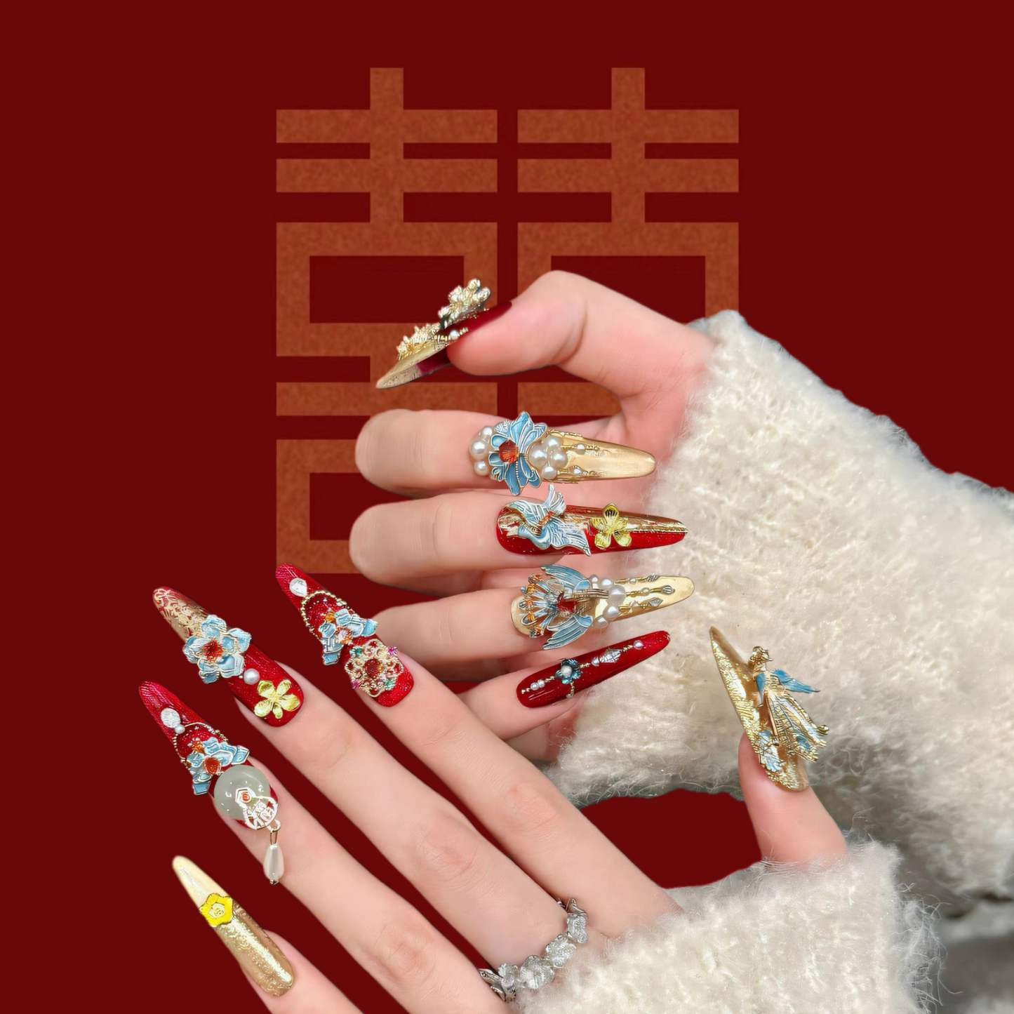 Decorative nail art with colorful designs on a red background with Chinese characters.