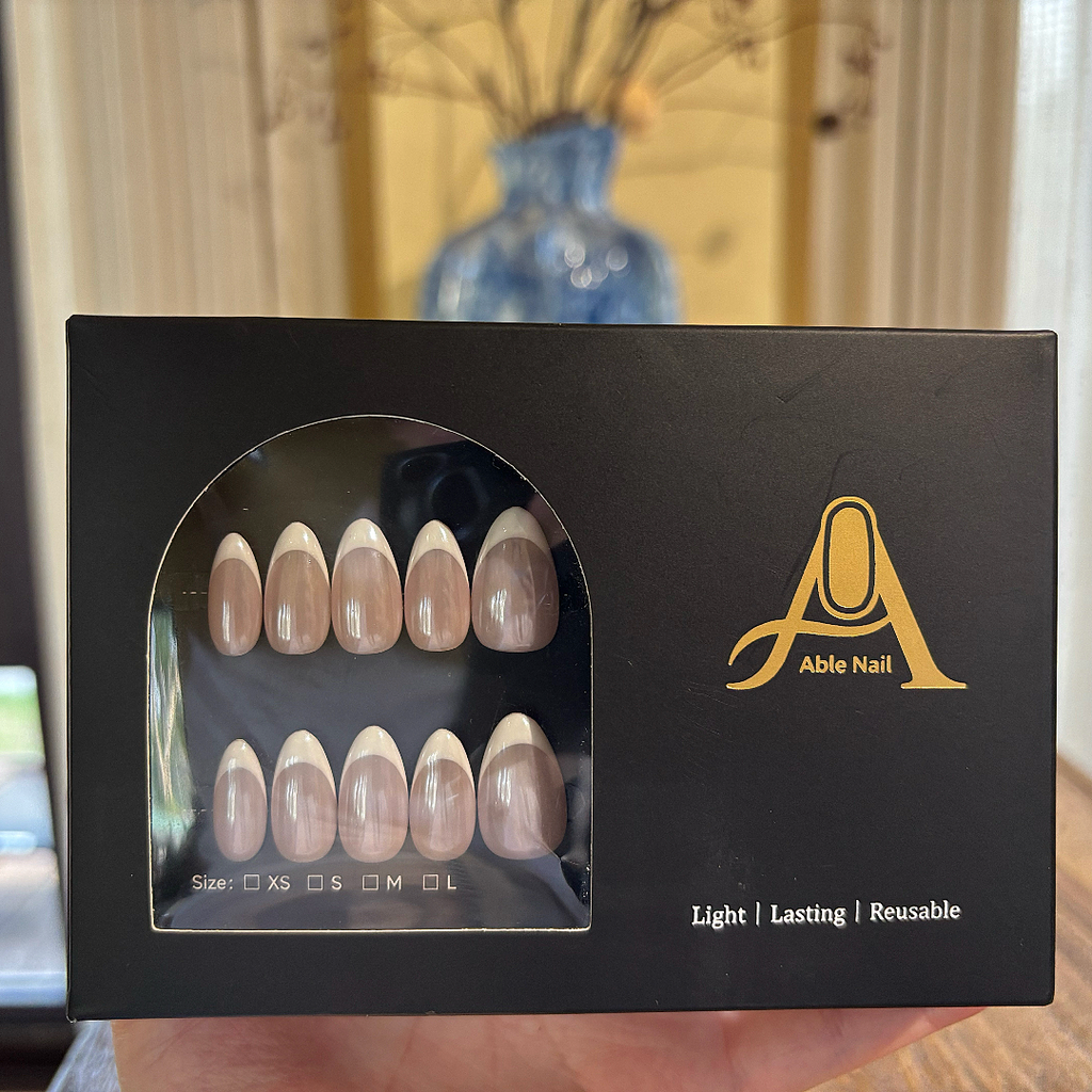 Box of Able Nail products with a clear window showing nail samples.