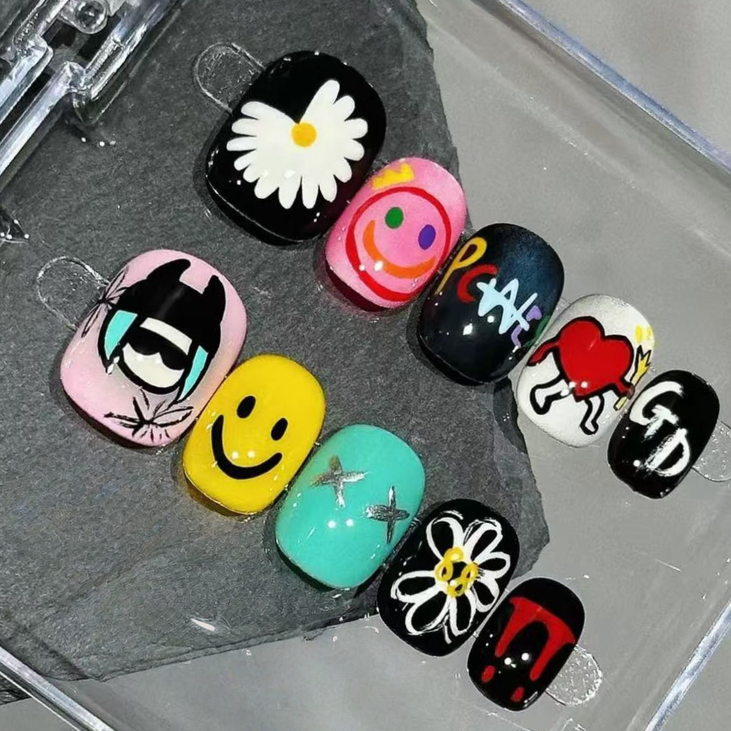 Set of colorful nail art designs on a white background