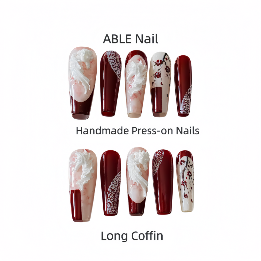 Set of ABLE Nail handmade press-on nails in long coffin shape with red and white design.