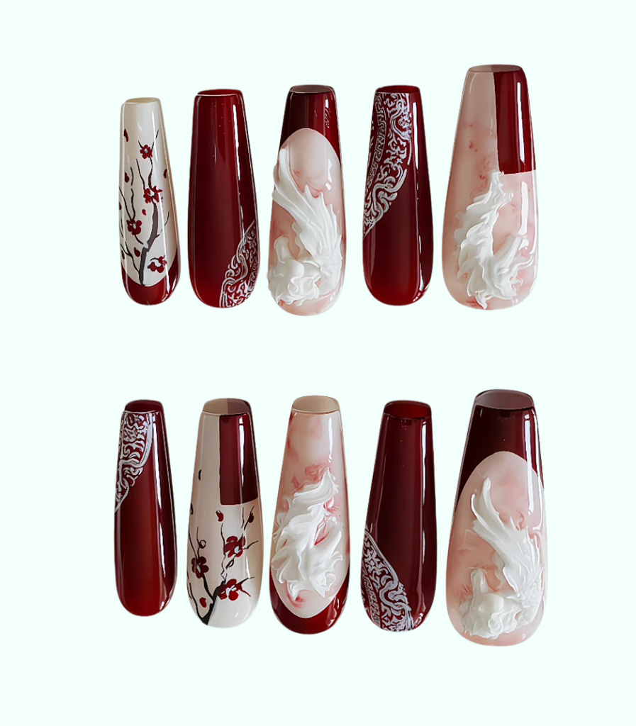 Set of nail art designs on long, oval-shaped nails with red and white patterns.