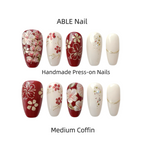 Handmade press-on nails with floral designs on a white background, branded 'ABLE Nail'.