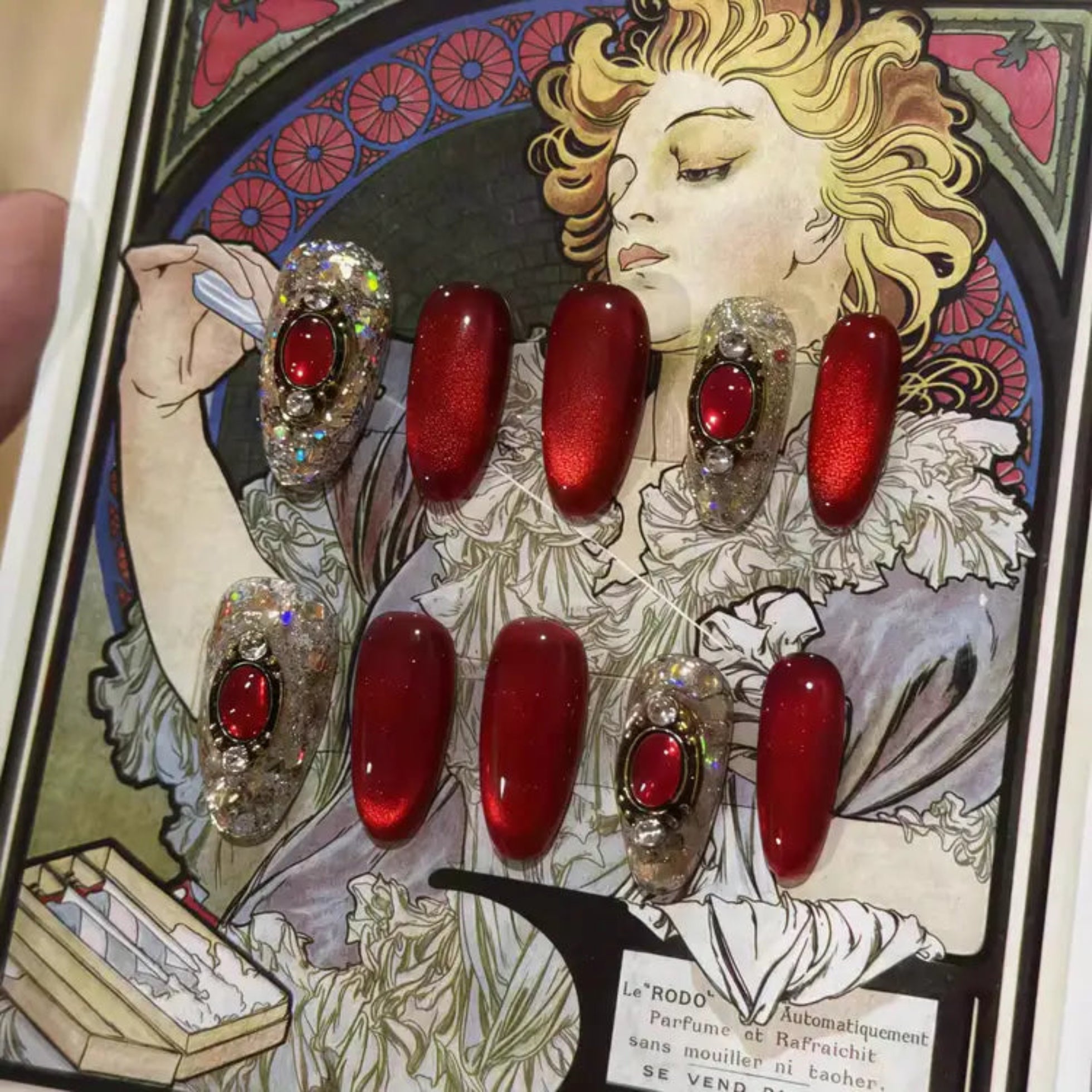 Red nail polish set displayed on a vintage-style card with a woman's face.