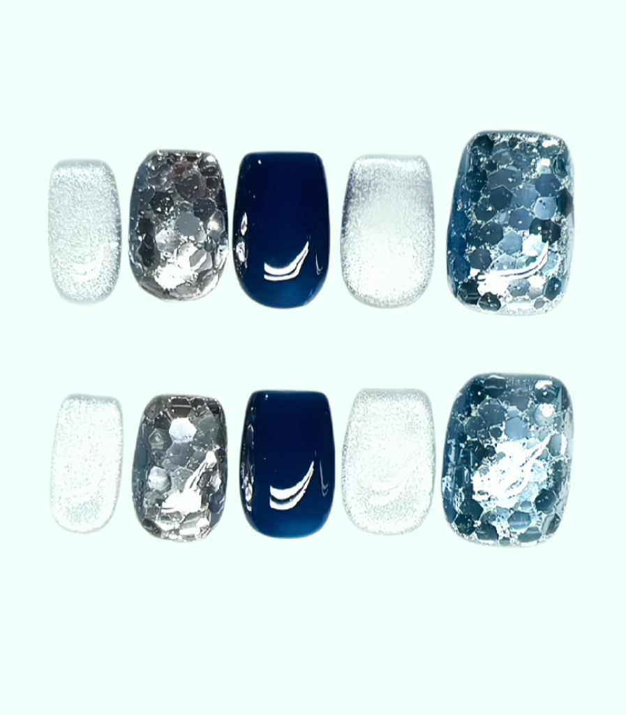 Set of nail wraps with blue and silver designs on a white background
