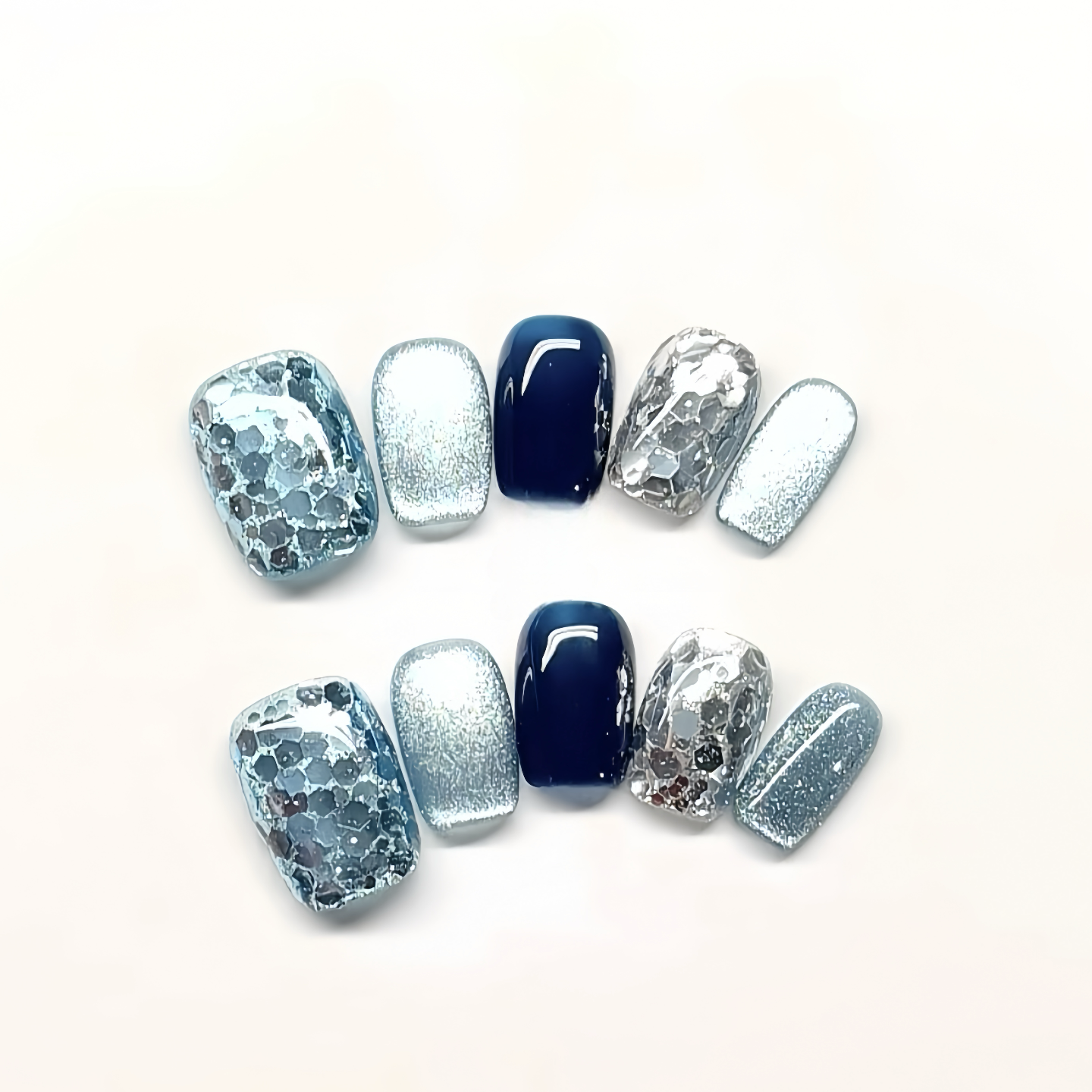 Set of blue and silver nail designs on a white background