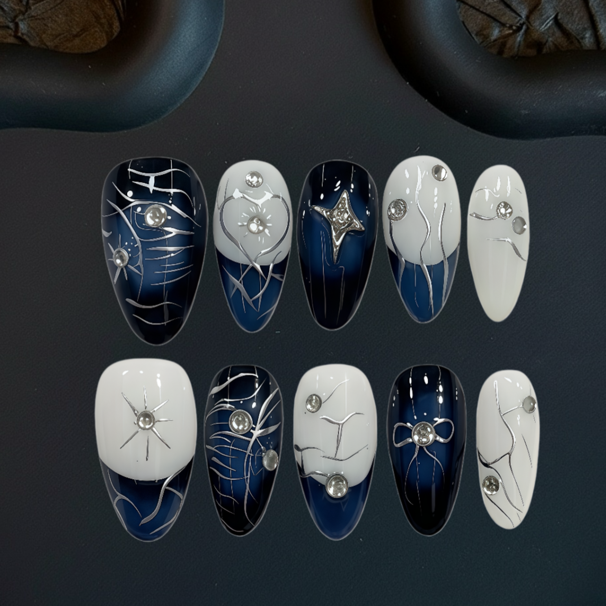 Set of nail art designs on a dark background