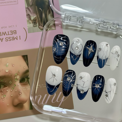 Set of blue and white decorative nails in a clear case with a woman's face in the corner.