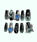 Decorative false nails with fantasy designs on a white background