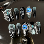 Decorative false nails with fantasy designs on a reflective surface