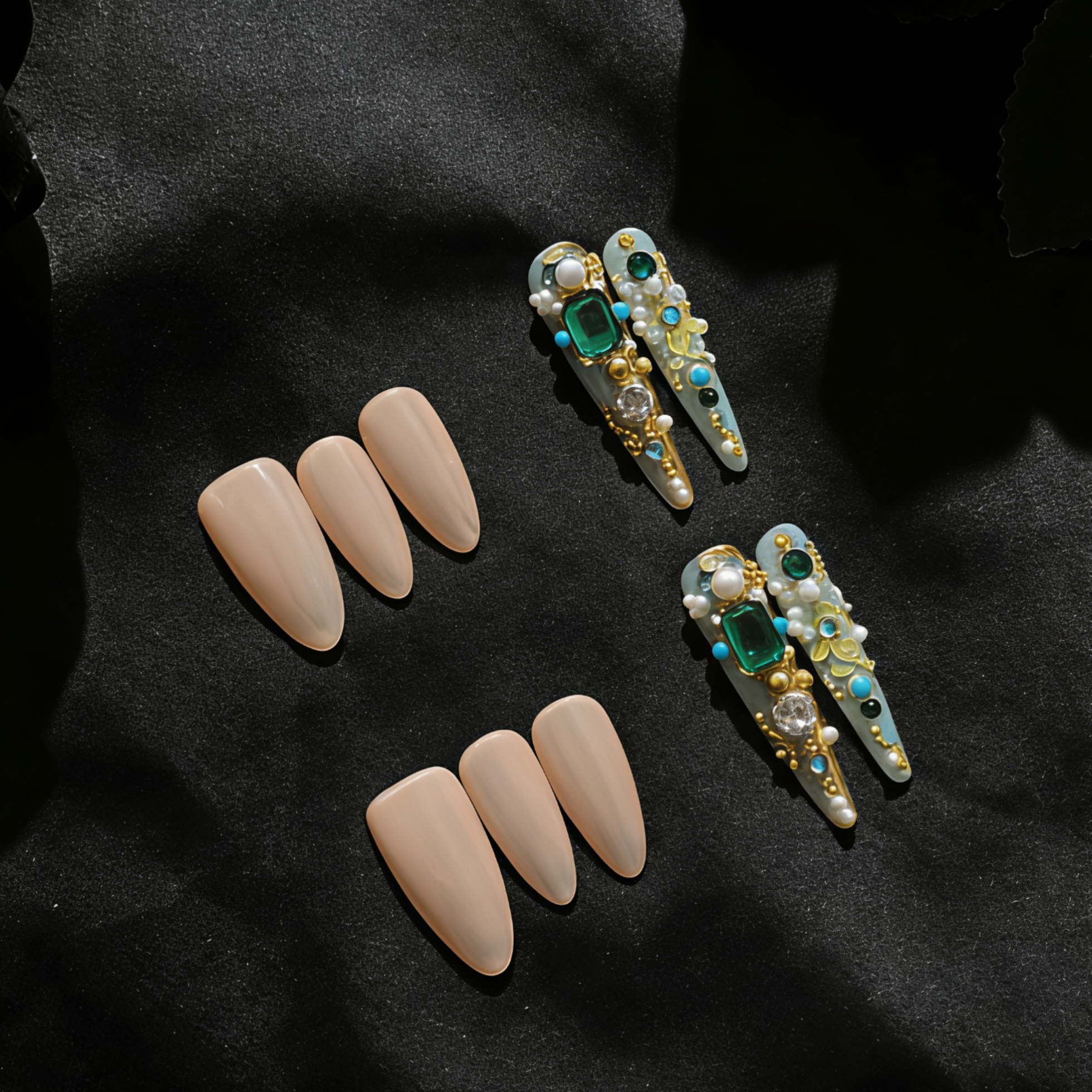 Decorative hair clips with gemstones and nude-colored hair extensions on a black background
