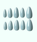 Set of light blue nail polish on a white background